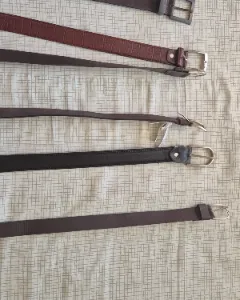 Six LEATHER belts.